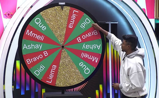 Ashay, the Big Brother Mzansi Season 6 week 9 Head of House, spinning the Redemption Wheel in the house lounge